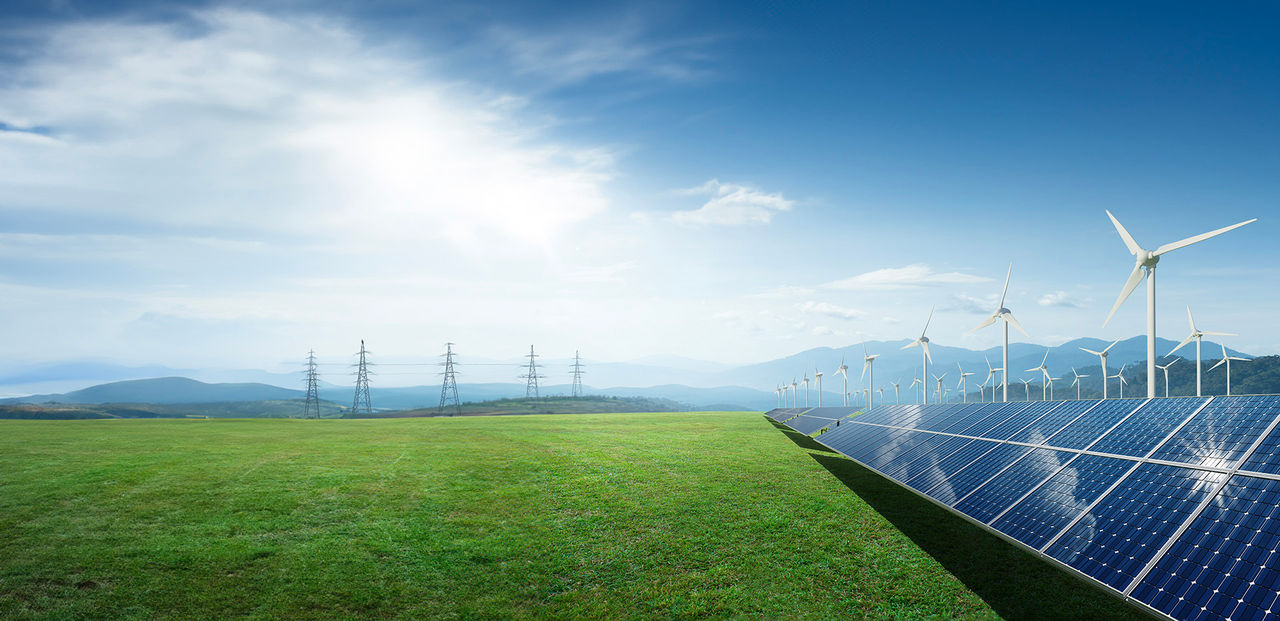 Solar panels and wind generators under blue sky. Eco, clean, sustainable energy concept. 3d rendering