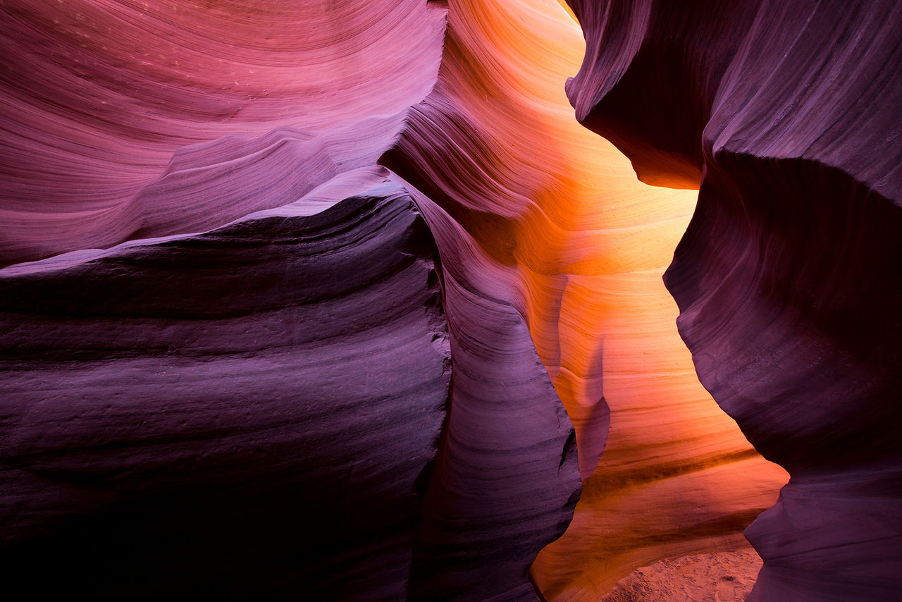 The meandering walls of the underground labyrinth of colored sand of the Lower Antelope Canyon in Page Arizona create unique combinations of light shadows and colors